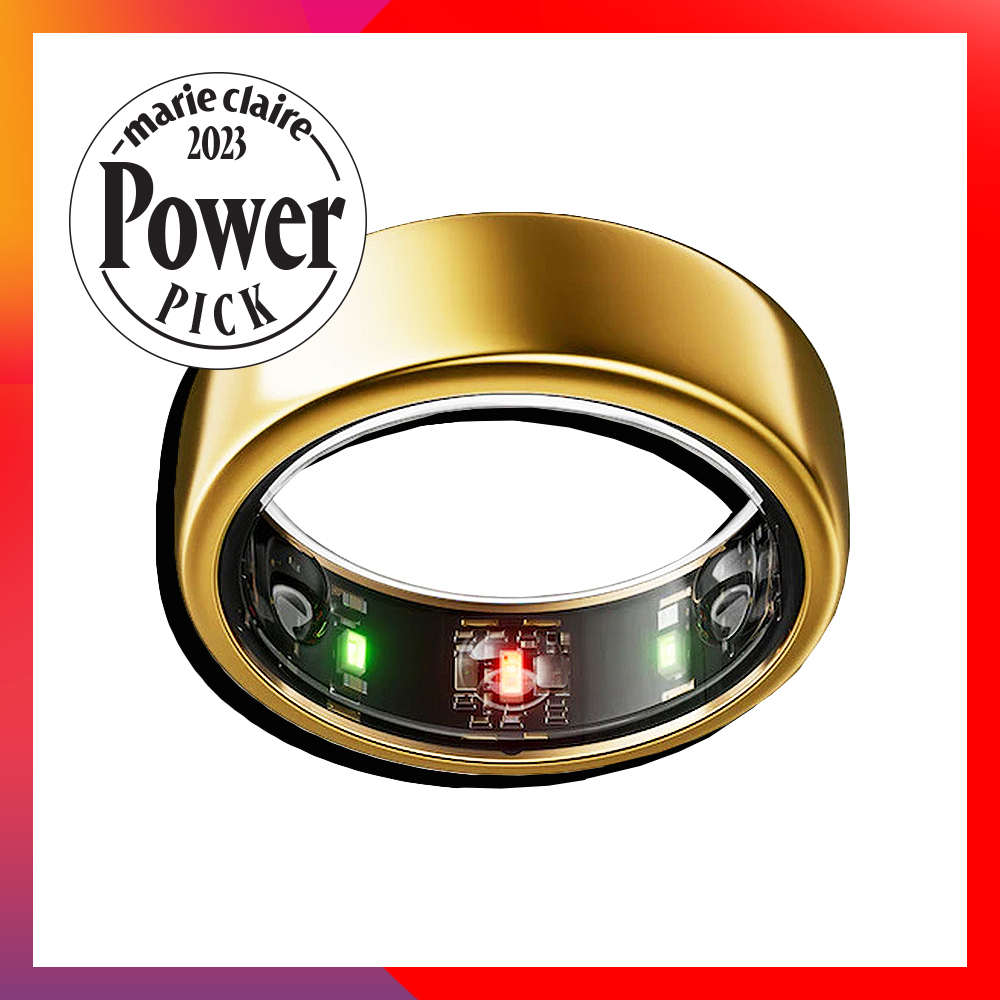 A gold ring with black and green lights and circuitry within the band