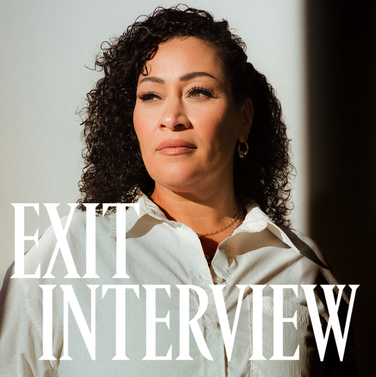 Image of Tania Flynn, Head of Design at Athleta, wearing a white button-down shirt.