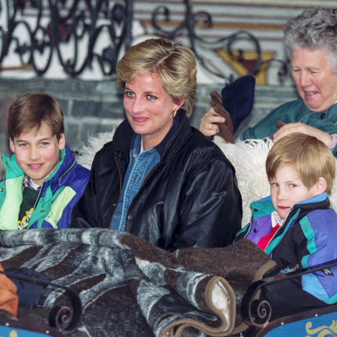 Prince William, Princess Diana, and Prince Harry ride in a sleigh