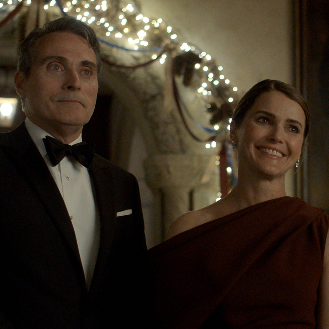 hal and kate wyler smiling and dressed in formal wear at an event in the diplomat