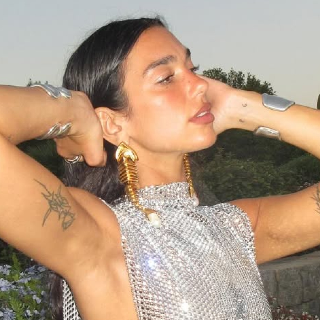 Dua Lipa celebrates her 30th birthday in a custom silver chainmail dress with side splits and open side torso