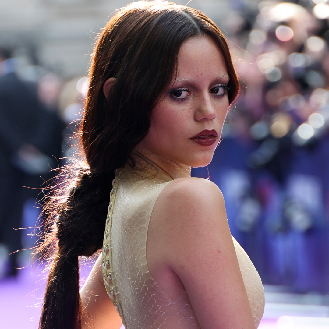 Jenna Ortega swapped a bikini for a leather trench coat and boots at the beach