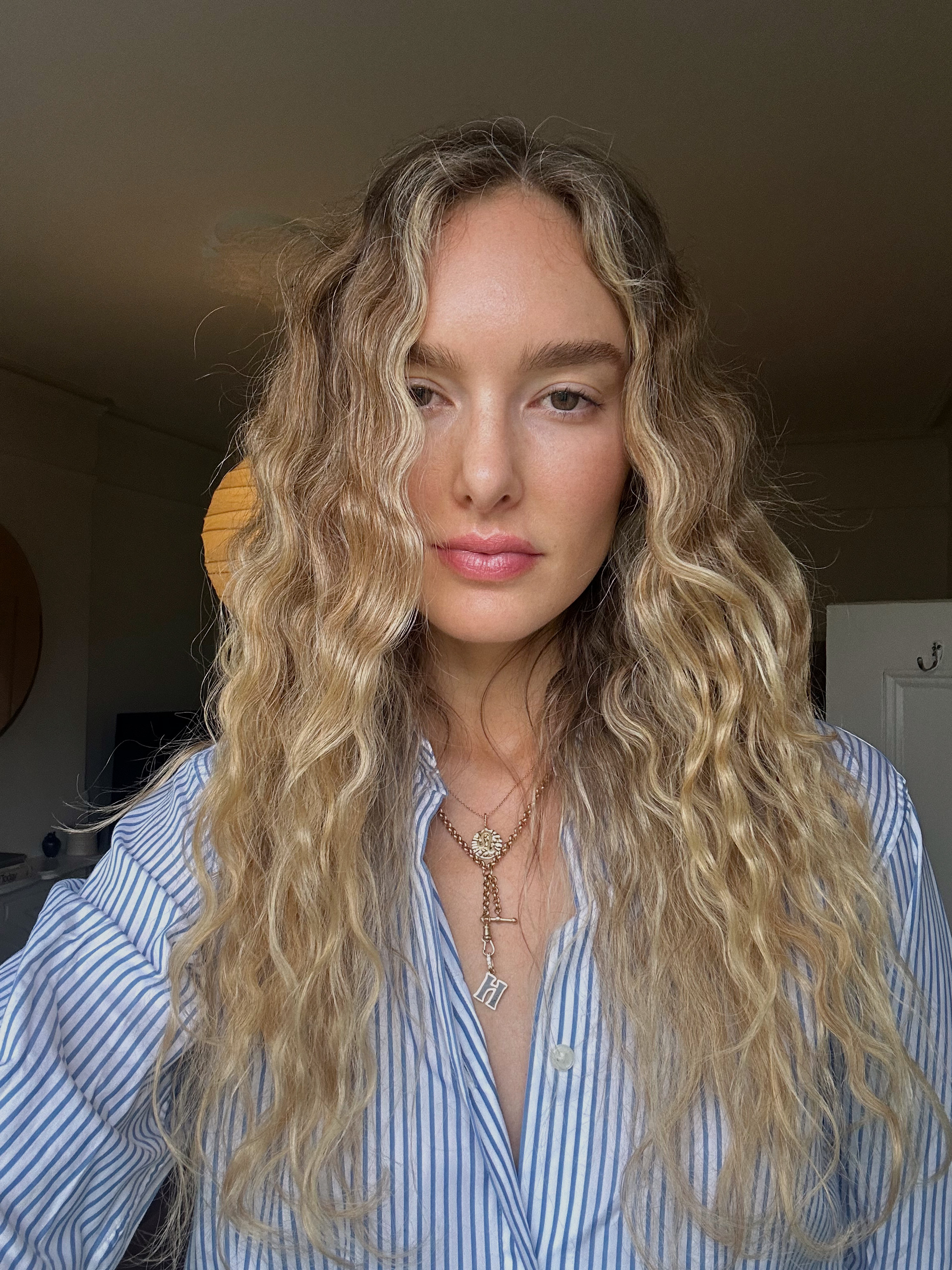 Hannah Baxter wearing a blue stripe shirt